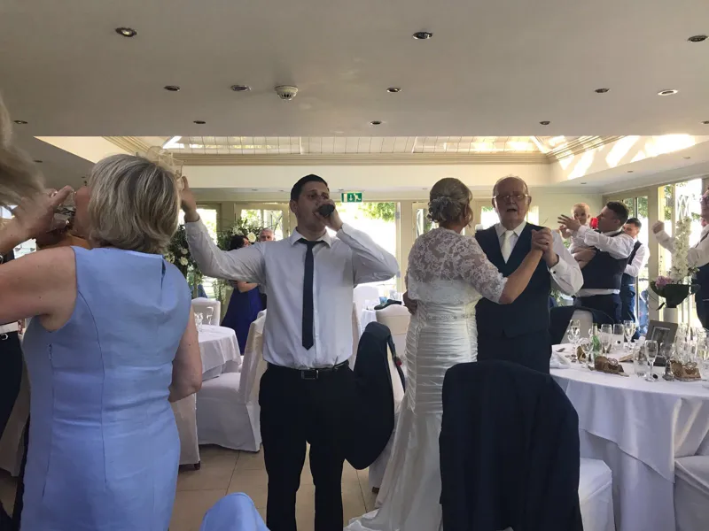 Solo singing waiter performing during an intimate wedding breakfast